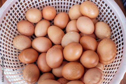 Chicken eggs in a basket container. The most common source of protein consumed daily