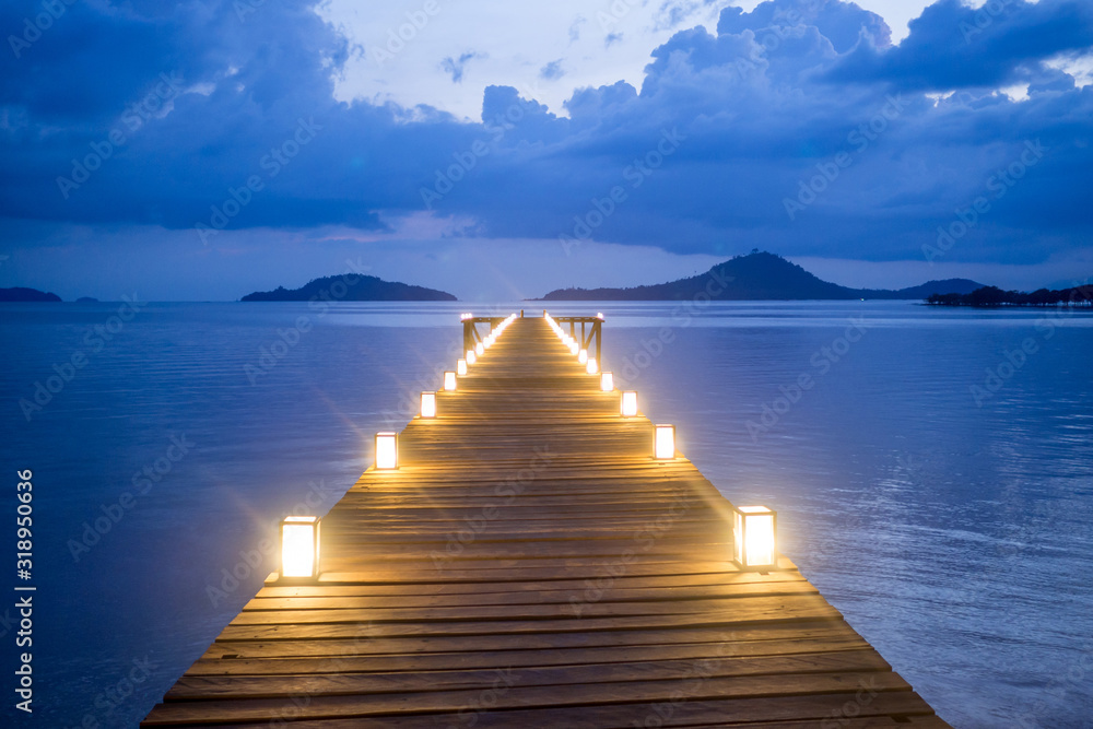 picture of lights on the bridge that extends into the sea picture of lights on the bridge that extends into the sea