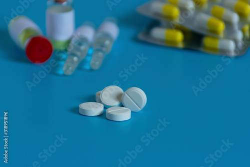 Medicines for the virus and flu. Medical pills and antibiotics. Coronavirus, personal protective equipment, medicine, vaccine and tablets. Virus, healthcare and medicine concept..