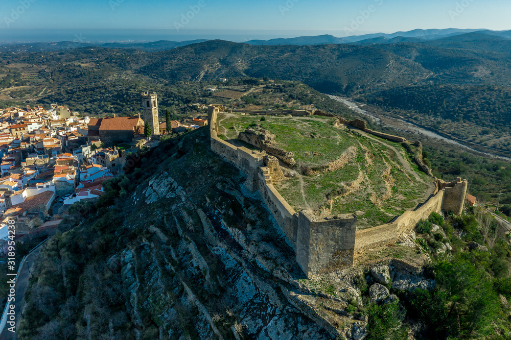 Aerial view of Cervera de Maestre castle with ruined excavated inner building remains surrounded by a partially restored outer wall of Arab origin