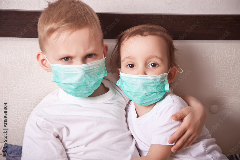 Boy and girl, a children in a medical mask. The concept of an epidemic, influenza, protection from disease, vaccination.