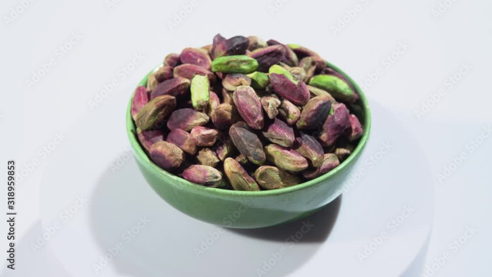 Rotation of emerald green pistachio nuts from Bronte, Sicily, Italy Rotation of emerald green pistachio nuts from Bronte, Sicily, Italy