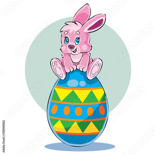 cute bunny sitting on top of a large Easter egg painted in different colors,