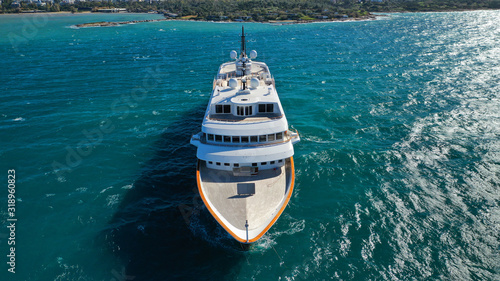 Aerial drone top down photo of luxury yacht docked in Mediterranean destination port with deep blue sea © aerial-drone