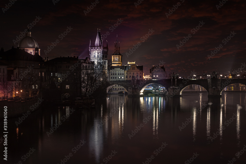 Night Prague City with Vltava River and Charles Bridge