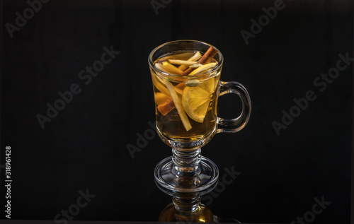 a hot drink in a glass on a dark background