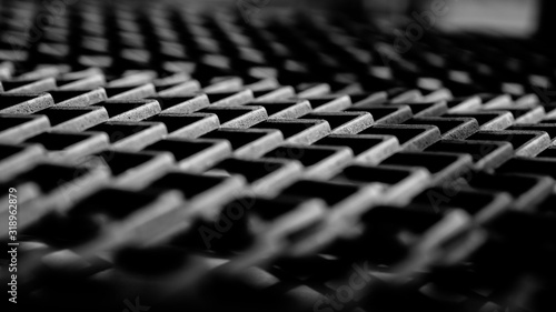 Black metal sieve, oblique stripes, for carrying heavy things
