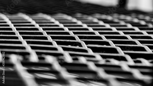 Black metal sieve, oblique stripes, for carrying heavy things