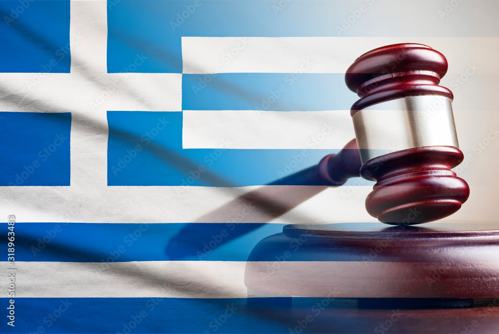 Legal gavel over a flag of the Greece