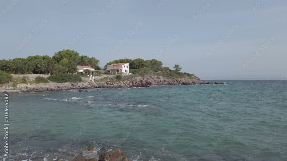 Panning view of Punta Nera bay at San Pietro island in Sardinia region, beautiful travel destination in Italy Panning view of Punta Nera bay at San Pietro island in Sardinia region, beautiful travel destination in Italy