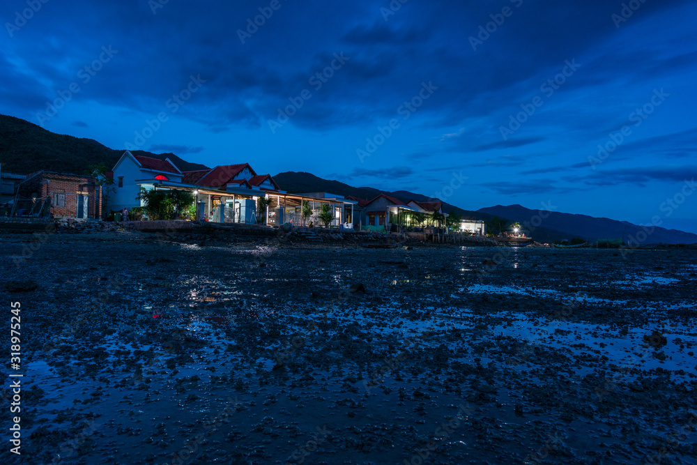 Fototapeta beauty bay in nha trang, vietnam with dramatic sky and light at sunset