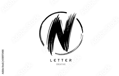 handwritten grunge N brush stroke letter alphabet logo icon design template in black and white for business