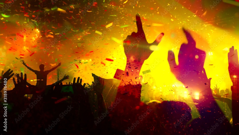 Fototapeta premium Concert Music festival and Celebrate. Party People Rock Concert. Crowd Happy and Joyful and Applauding or Clapping. Celebration party festival happiness. Blurry night club. Concert Show with DJ Music 