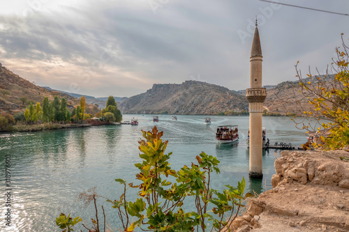Minaret of the mosque in the water of the dam