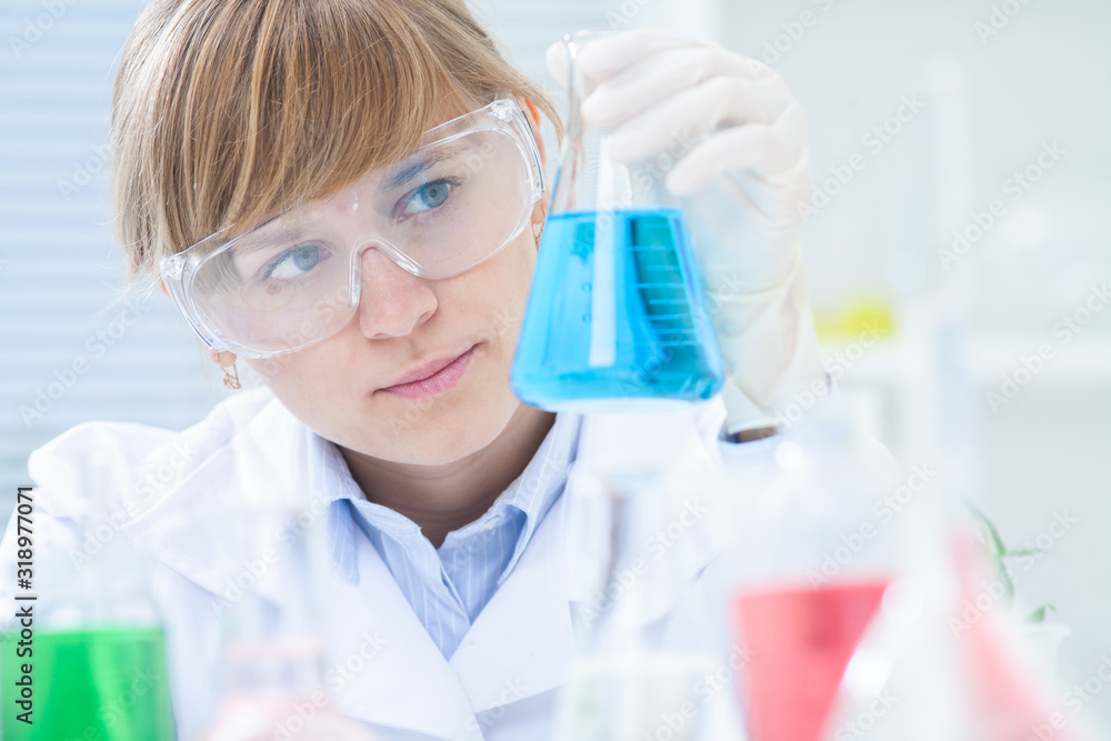 Researcher working with chemicals Researcher working with chemicals