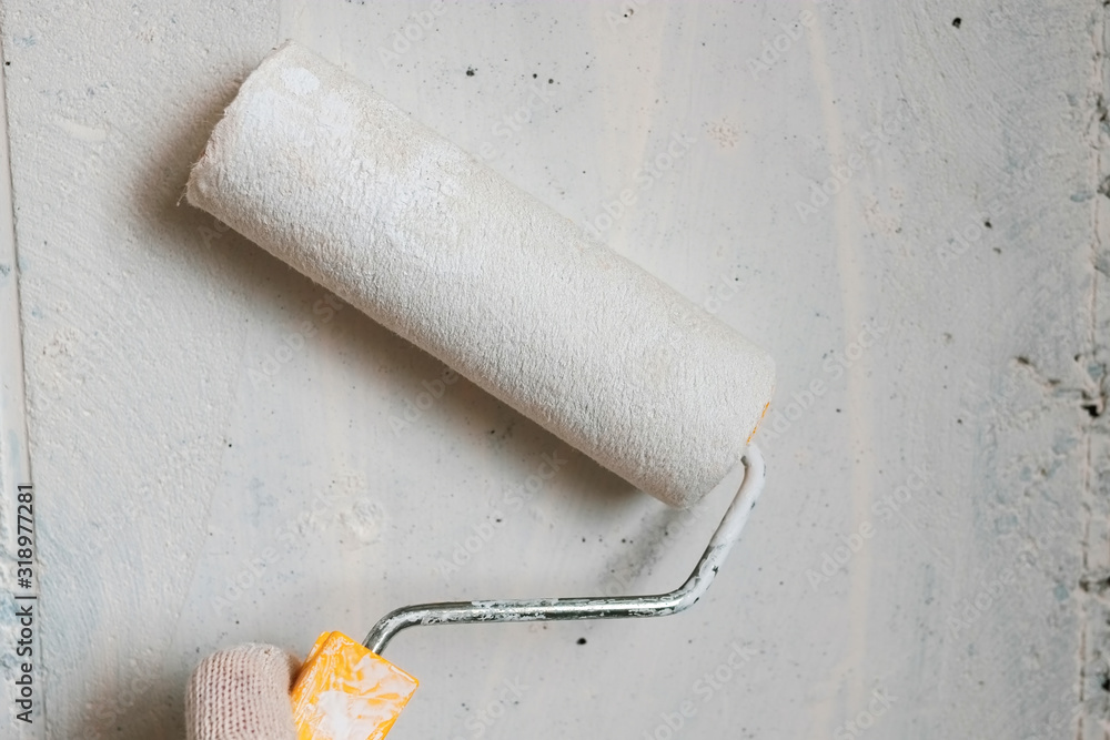 Obraz premium paint roller on white background