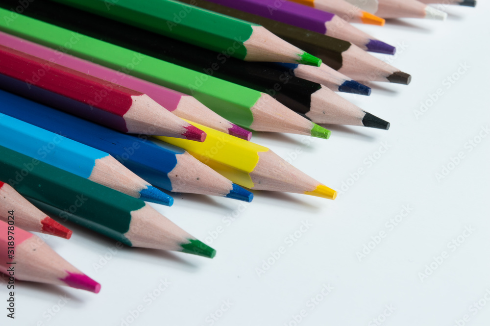 multicolored pencils on a white background. multicolored pencils on a white background.