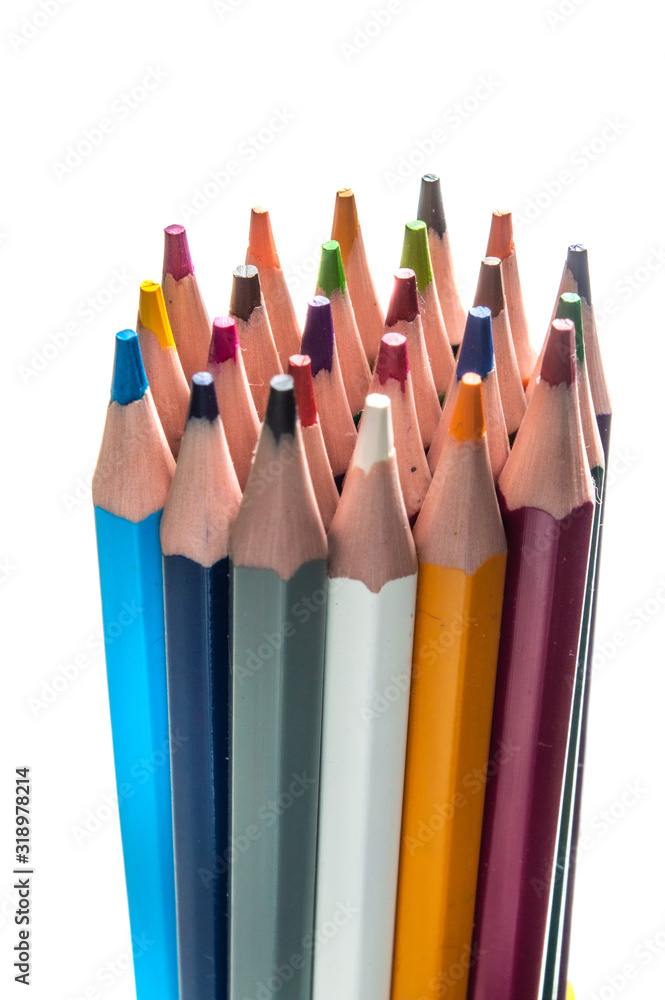 a stack of multi-colored pencils on a white background. a stack of multi-colored pencils on a white background.