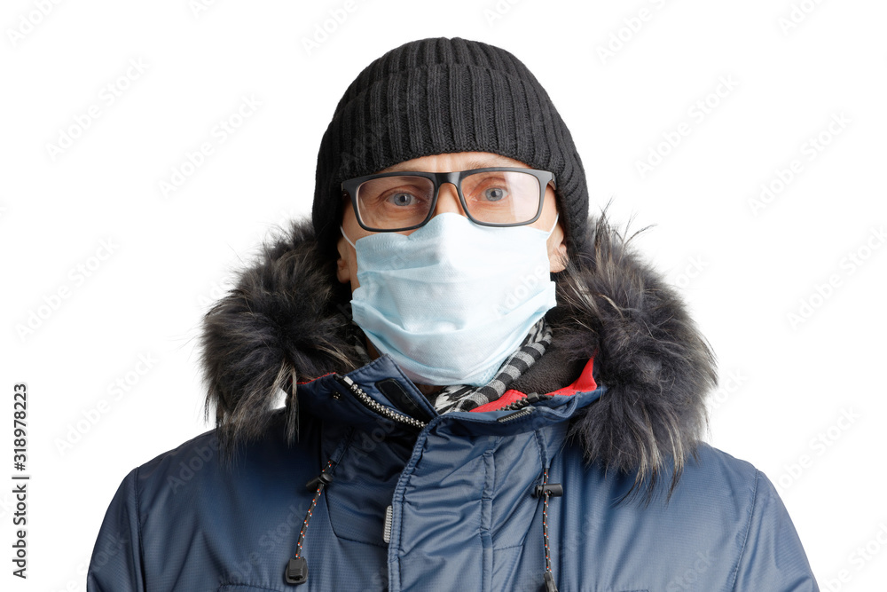 Closeup portrait of a man in winter clothes and a hat, glasses and a protective mask. Isolated on white. Closeup portrait of a man in winter clothes and a hat, glasses and a protective mask. Isolated on white.