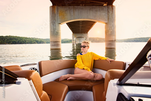 Girl on boat under bridge