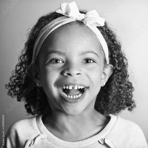 Happy Smiling Young Girl With Curly Hair