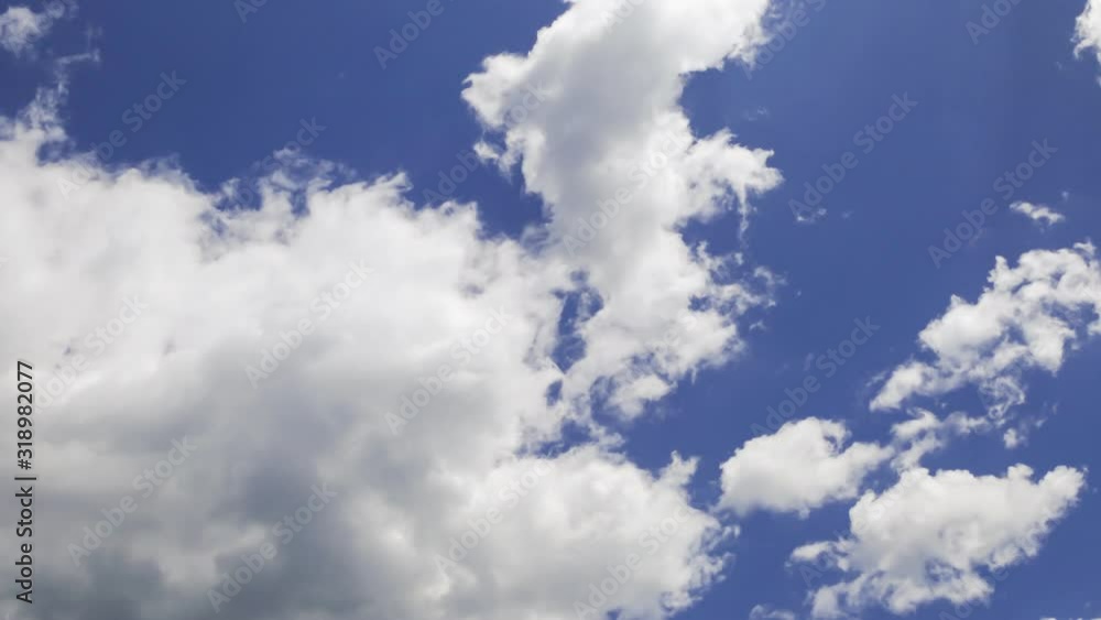 timelapse of white clouds moving fast in the clear blue sky timelapse of white clouds moving fast in the clear blue sky
