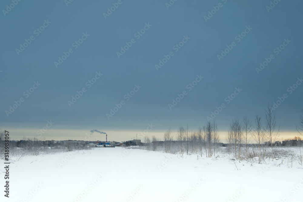 Blue sky with snow field. Great background with copyspace. Winter and snow landscape. Stock photo.
