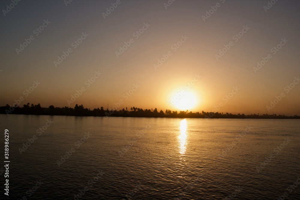 Sunset viewed from across a river