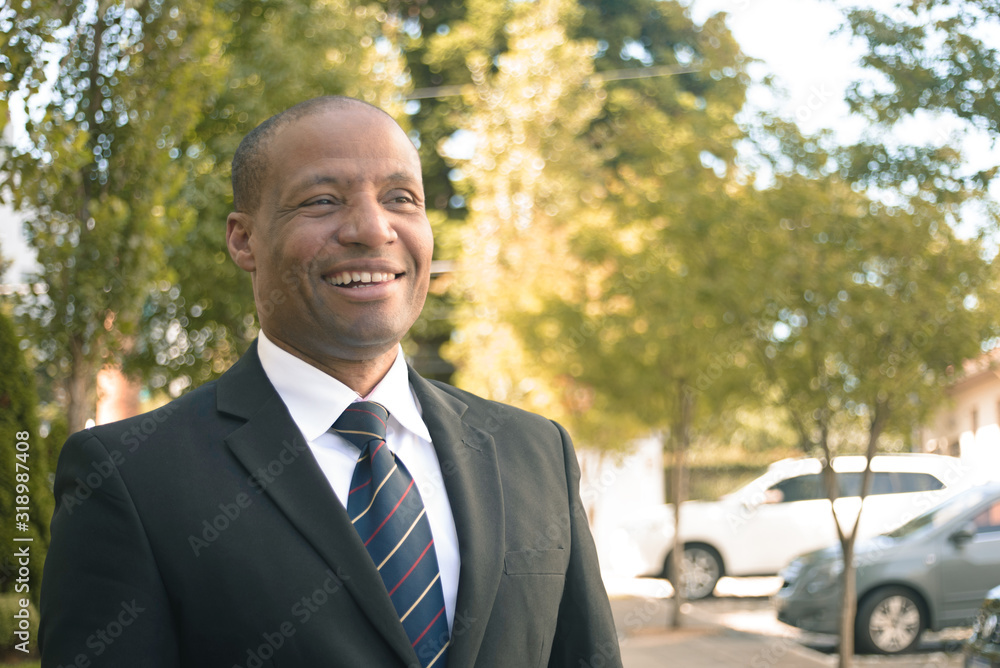 Black businessman in a suit loking successfull in an urban background Black businessman in a suit loking successfull in an urban background