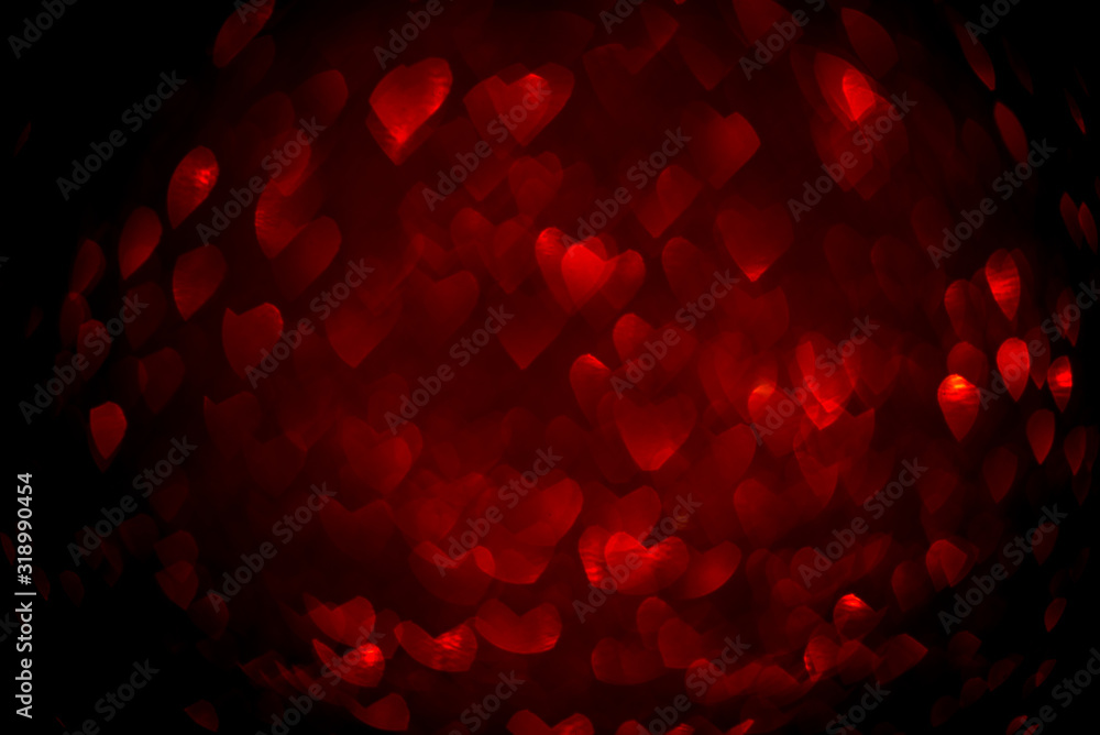 Fototapeta Background with red bokeh in the shape of a heart. Valentine's day concept.