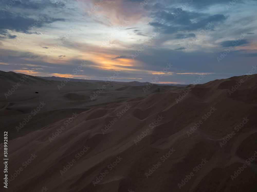 Sunset at the desert, multicolored sky at golden hour, Ica, Peru