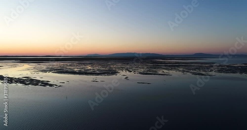Wallpaper Mural Aerial view of the Sado Estuary near the village of Carrasqueira, with a rice plantation, the Troia Peninsula and the Arrabida Mountain on the background at sunset, in Portugal. Torontodigital.ca
