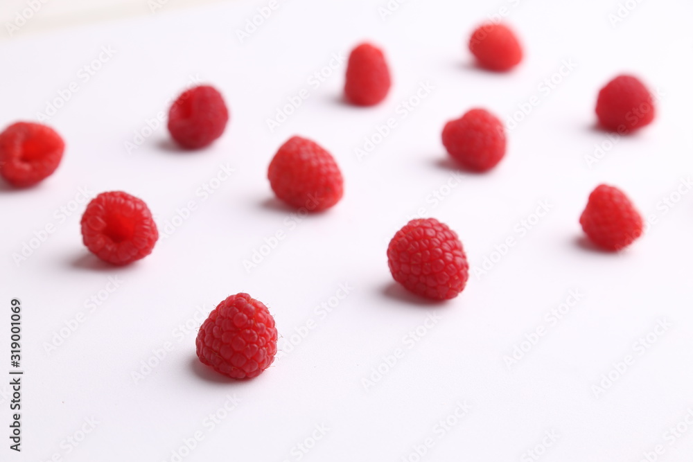 delicious raspberries in colorful background