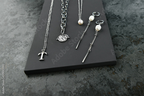 silver jewelry on a marble background. Jewelry for all lovers. View from above. photo