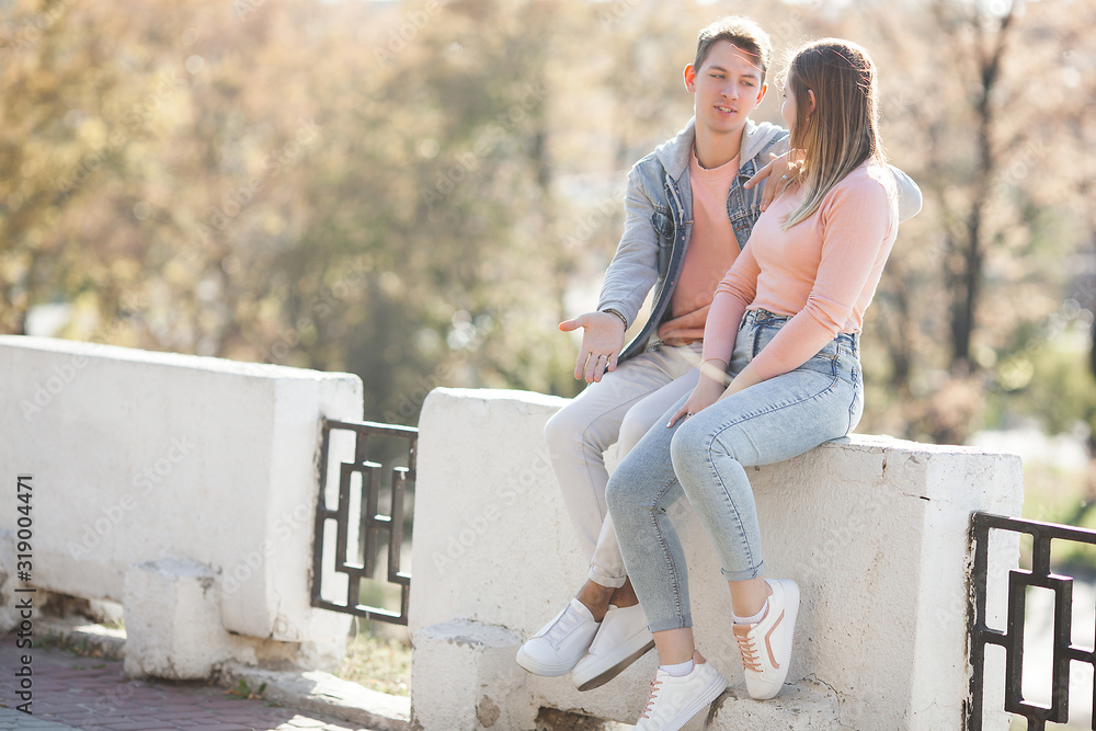 Lovely couple having fun. Young attractive woman and handsome man together walking in the city. Relationship.