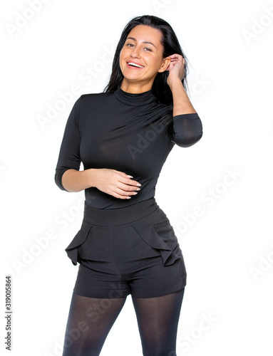 a young woman with dark hair and dark clothing on an isolated background in the Studio