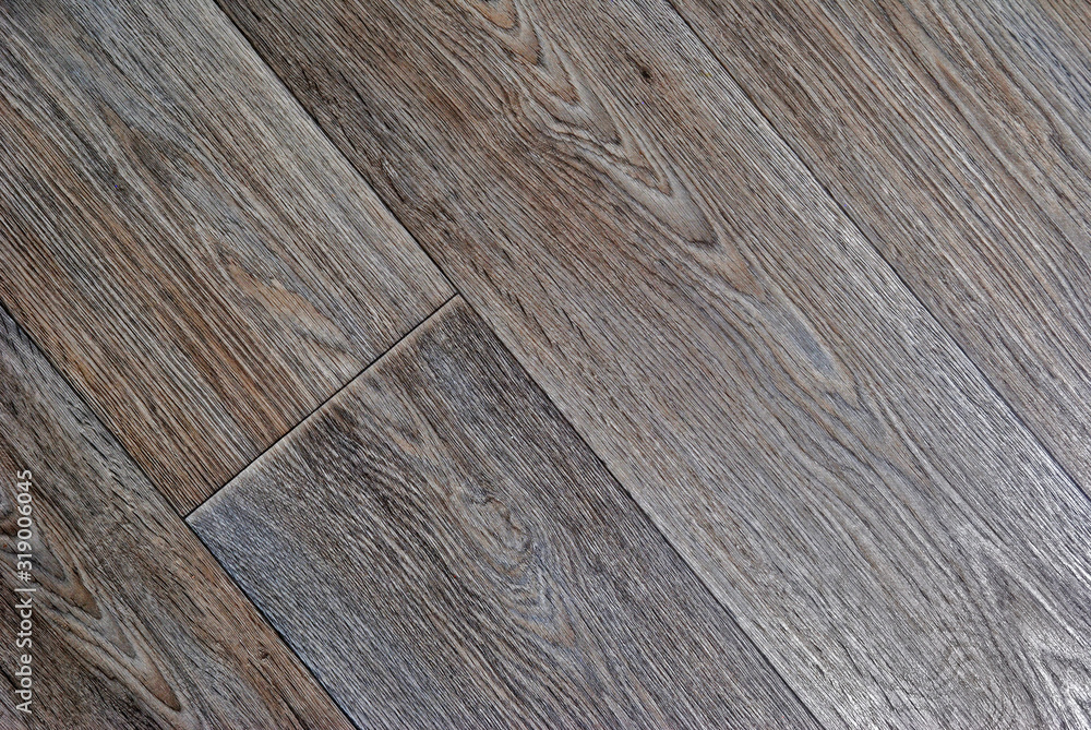 wooden background from a parquet board. toning and diagonal pattern wooden background from a parquet board. toning and diagonal pattern