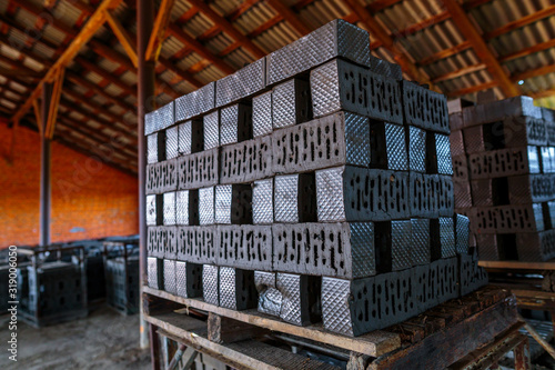 фотографія Production of clay bricks at a brick factory