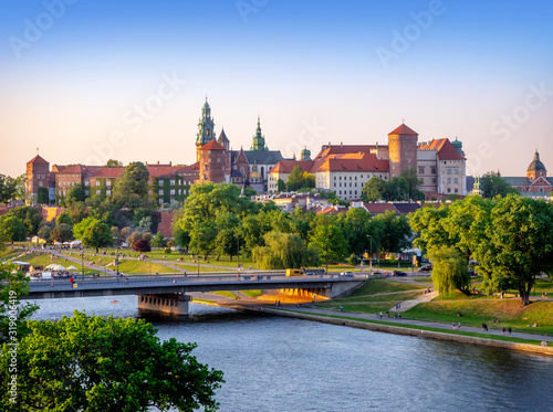 Krakow, Poland. Wawel castle and cathedral, Vistula river, Podwawelski bridge, trees and promenades in summer. Aerial view
