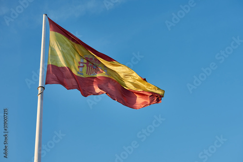 The flag of Spain from the Plaza de Colón. Madrid. Spain