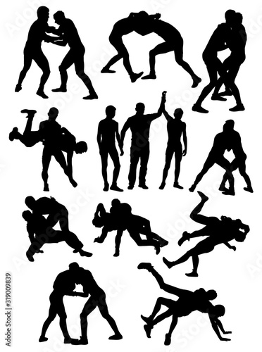 silhouettes of Greco Roman wrestling athletes vector