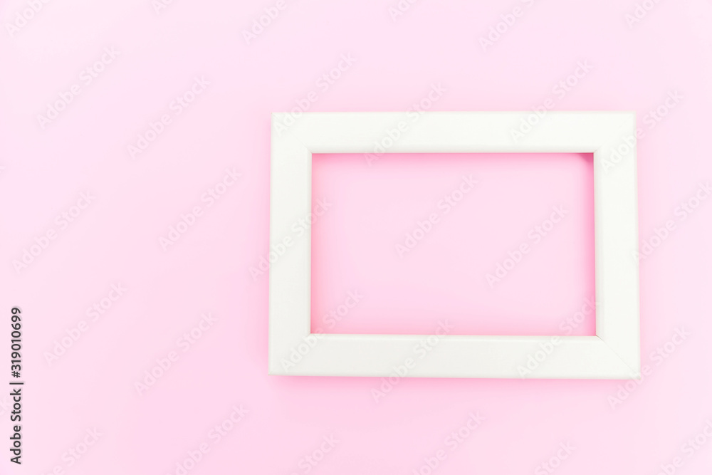 Simply design with empty pink frame isolated on pink pastel colorful background. Top view, flat lay, copy space, mock up. Minimal concept Simply design with empty pink frame isolated on pink pastel colorful background. Top view, flat lay, copy space, mock up. Minimal concept