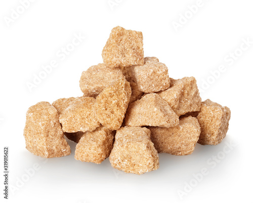 Brown crushed sugar close-up isolated on a white background.