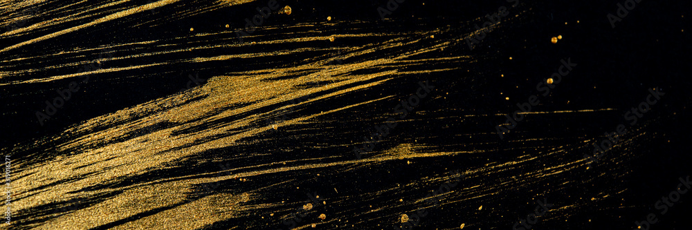 Obraz premium Golden curved lines on a black background. Web banner.