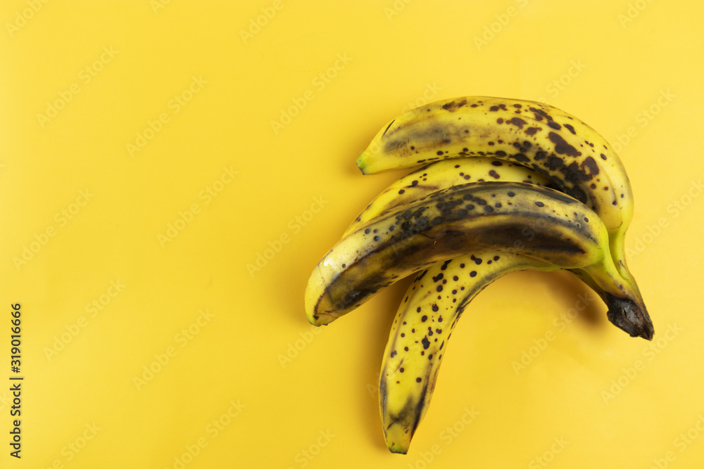 ugly bananas on a yellow background flat lay