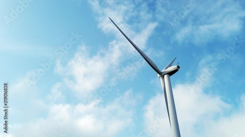 Éolienne sur un fond de ciel bleu avec quelques nuages - Parc éolien photo