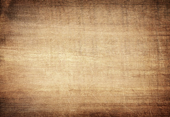 Brown scratched wooden cutting board. Wood texture