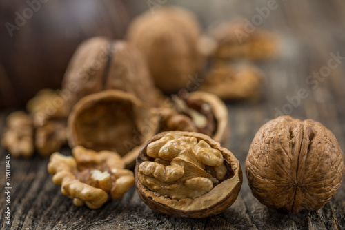 Handful of Walnuts on wooden background