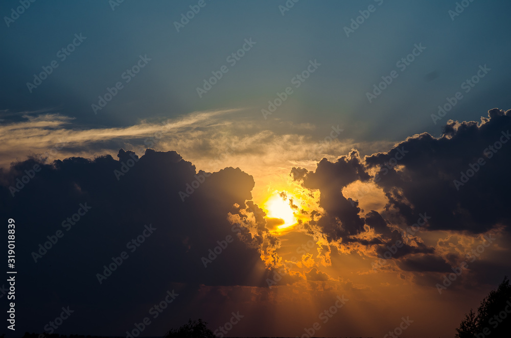 Sunset / sunrise with clouds, light rays and other atmospheric effect Sunset / sunrise with clouds, light rays and other atmospheric effect