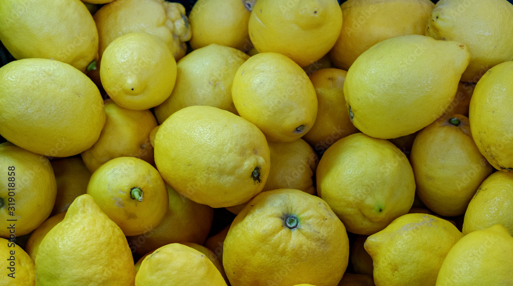 yellow lemons on market stall